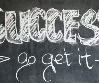 Chalkboard with "Success - Go Get It" written on it.