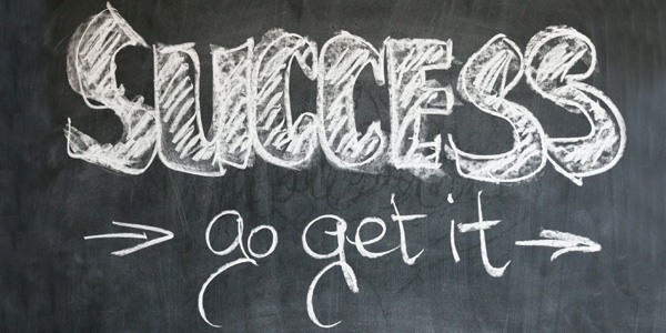 Chalkboard with "Success - Go Get It" written on it.